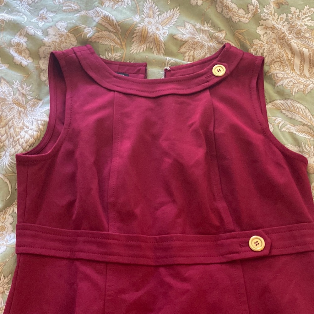 Talbots petite wine colored dress. Gold accents. Stretchy material. Zipper back.
